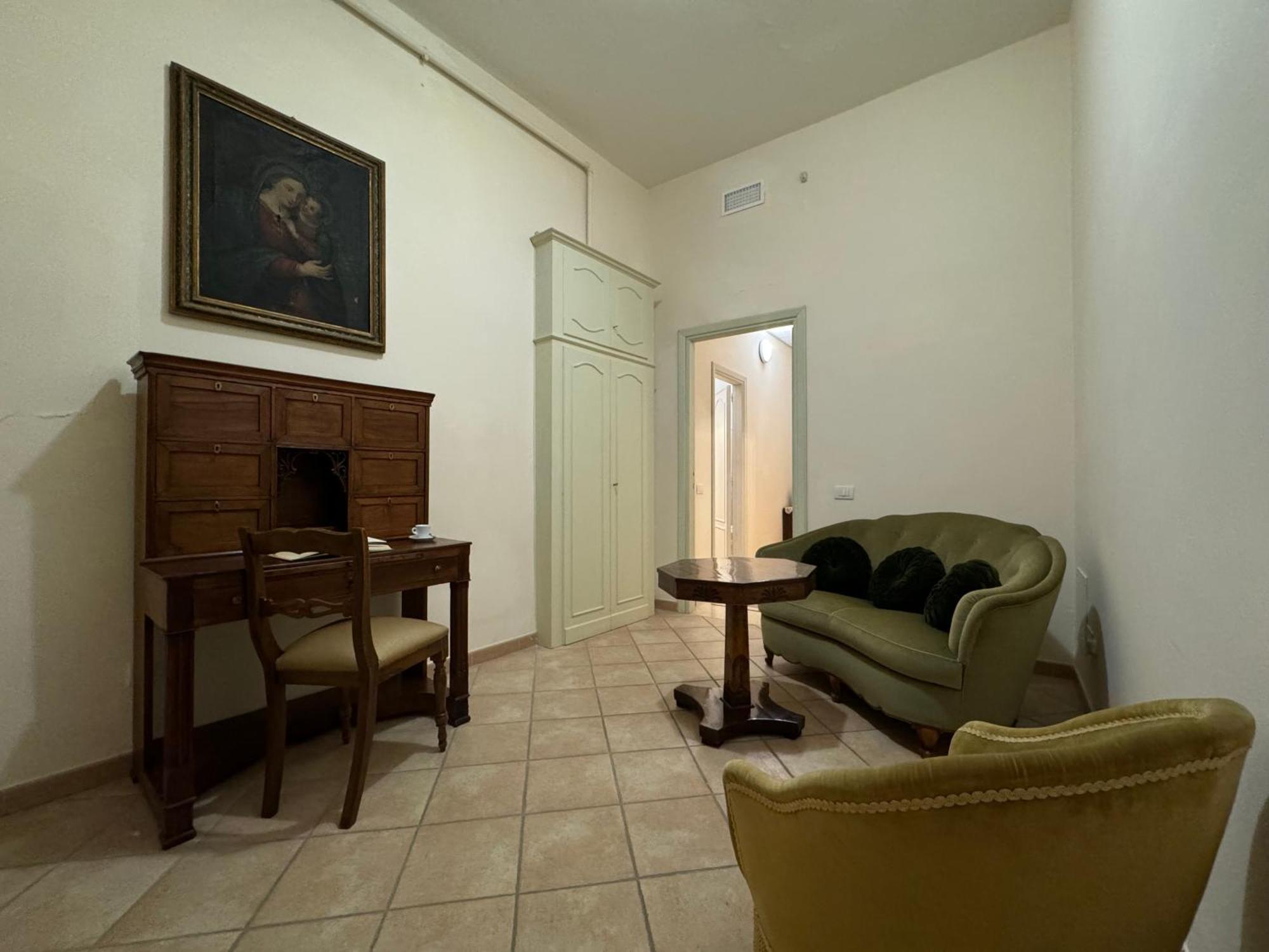 Monastero Ss. Annunziata Hotel Todi Exterior foto The living room of the apartment